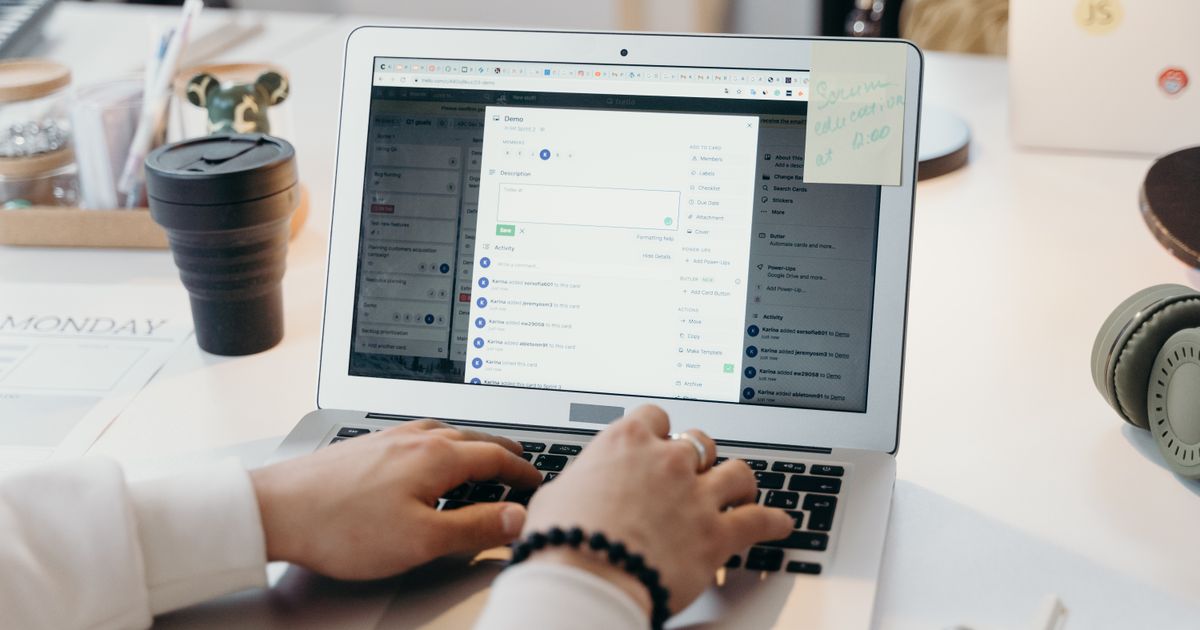 A professional working at a laptop — the kind of email archiving work that compliance regulations require.